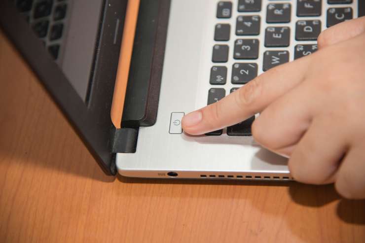 What do you risk if you press the power button on your computer to turn it off?